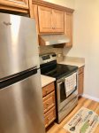 Upgraded stainless steel appliances in this inviting kitchen space.